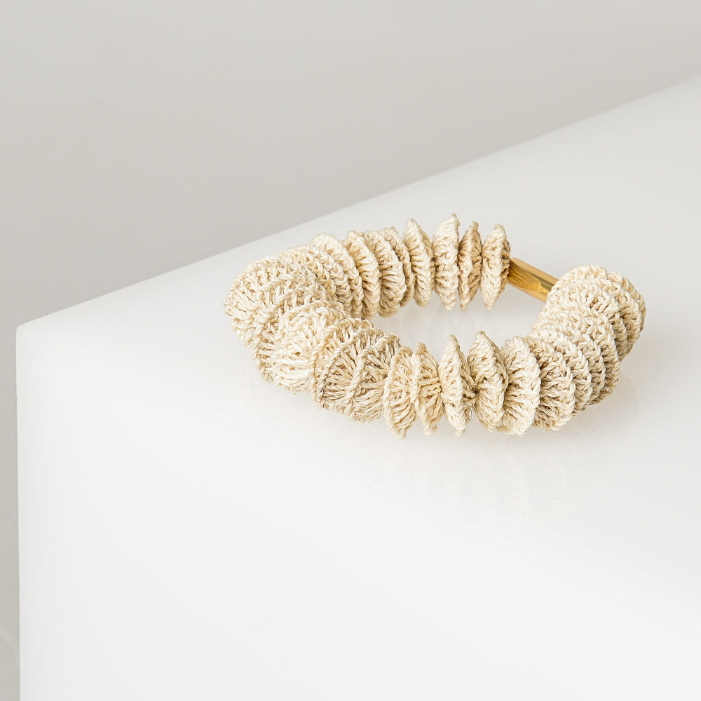 Stretch bracelet featuring 33 woven, natural fibre bilum beads and one rose gold plated bar bead.