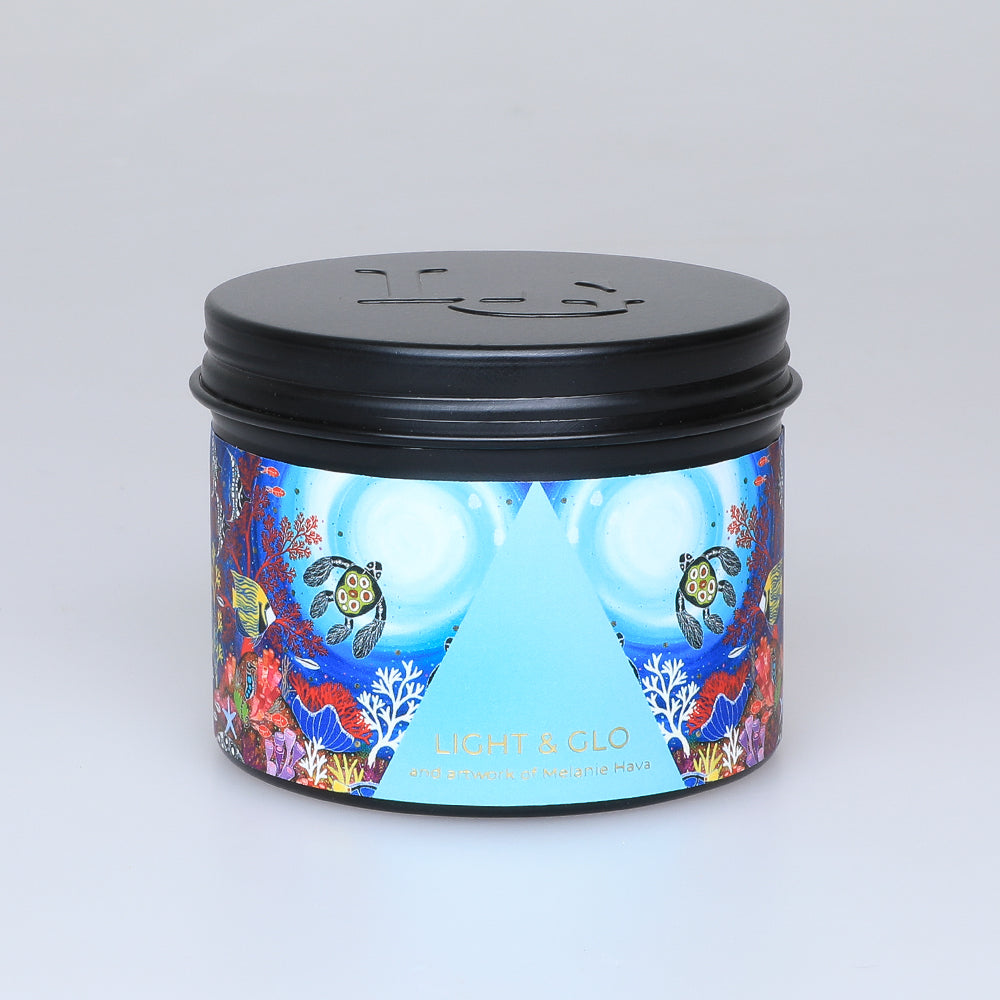 TRavel tin with fragrant soy wax candle with artwork by First Nations artist, Melanie hava Australian Museum Shop online