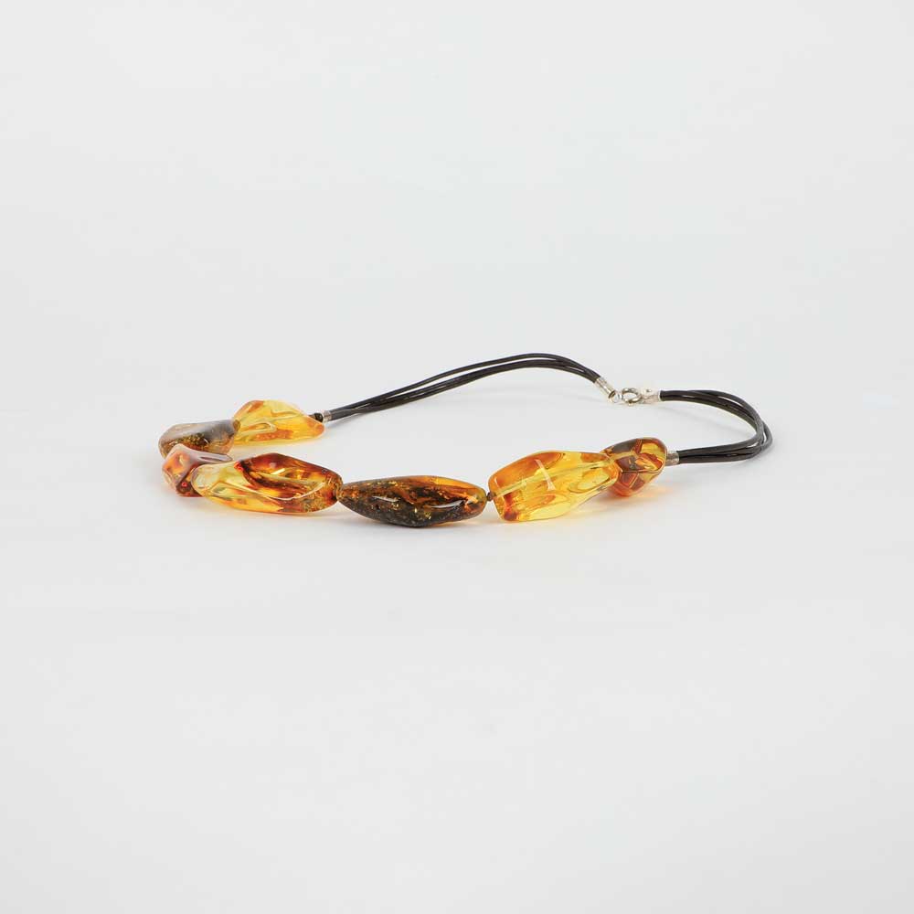 7 pieces amber necklace on white background