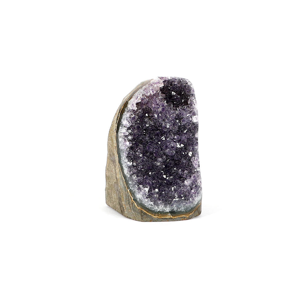 Amethyst crystal cluster scuplture on a white background. Side view