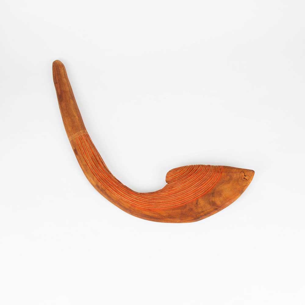 Andy Snelgar handcarved throwing club on white background for Australian Museum Shop Online