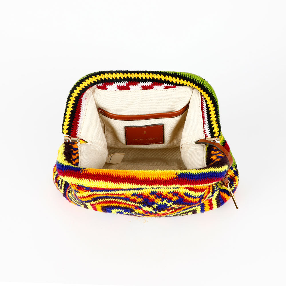 Colorful Barbara hand woven Bilum bag with geometric pattern, interior view, on a white background