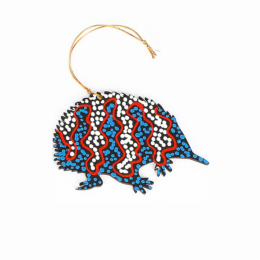 Decorative echidna ornament handpainted by Warlukurlangu Artists, on a white background