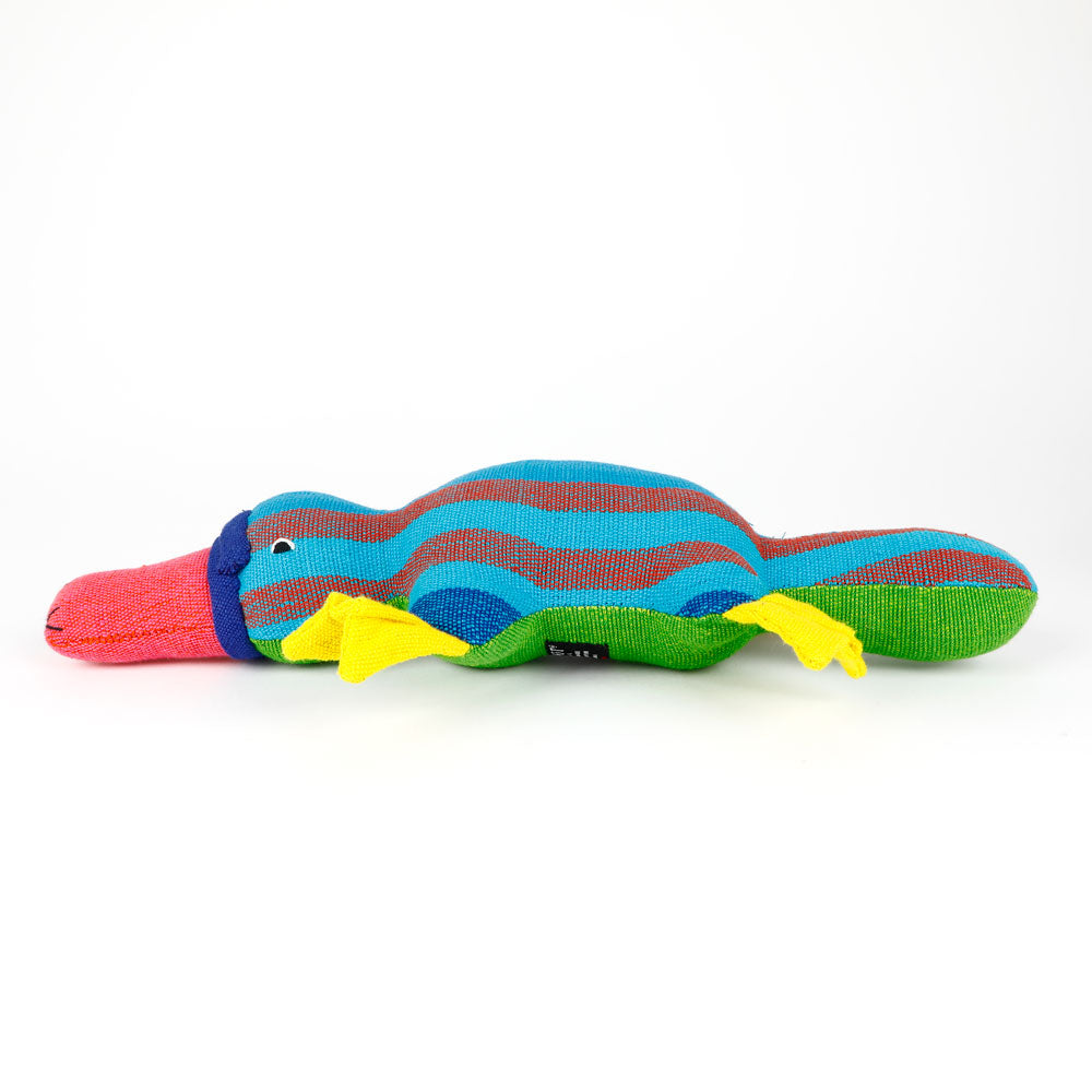 Colorful blue striped platypus hand made from handwoven fabric by Barefoot Toys on a white background