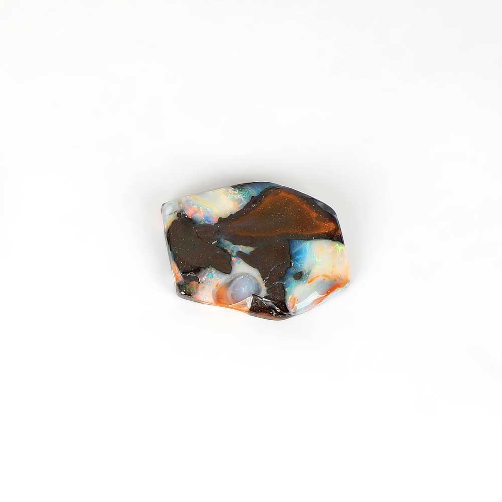 Boulder opal specimen on white background