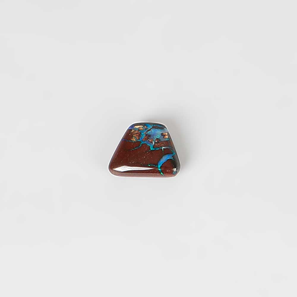 Boulder opal specimen on white background