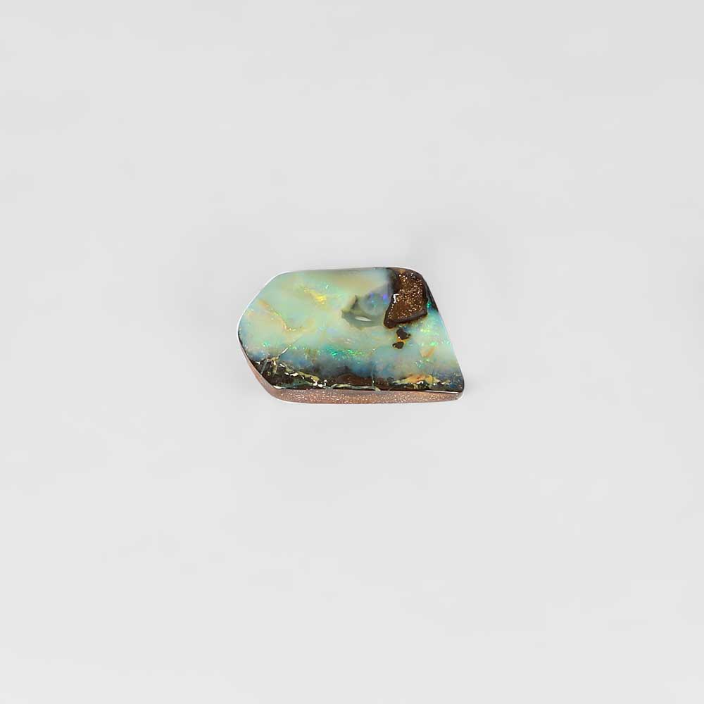 Boulder opal specimen on white background