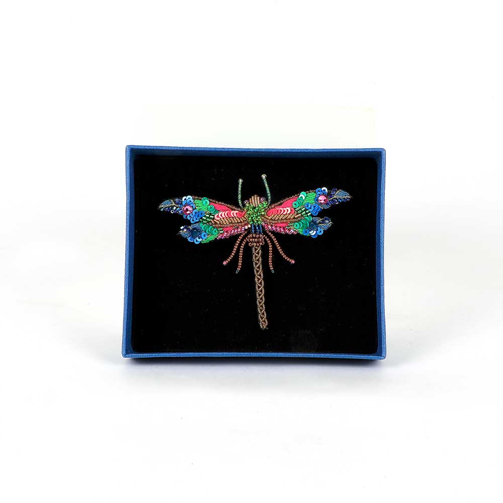 Trovelore Beaded nature brooch hand made in india on white background. Braid dragonfly