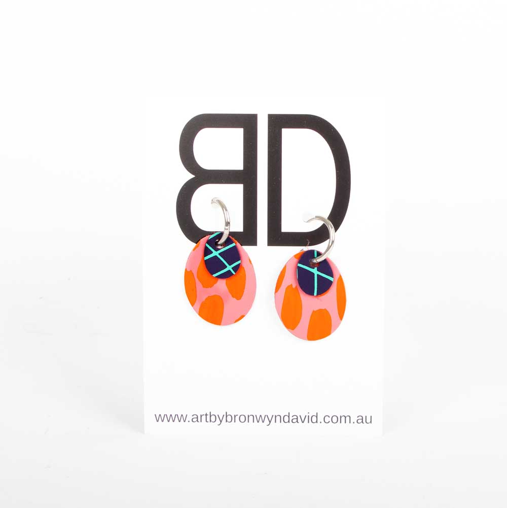 Bronwyn David handmade hand painted leather earrings with surgical steel hoops on white background