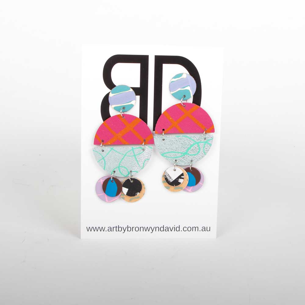 Bronwyn David handmade hand painted leather earrings with surgical steel studs on white background