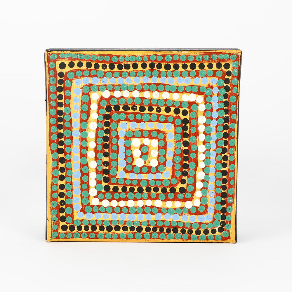 Handpainted canvas from Warlukurlangu Artists Cooperative on white background