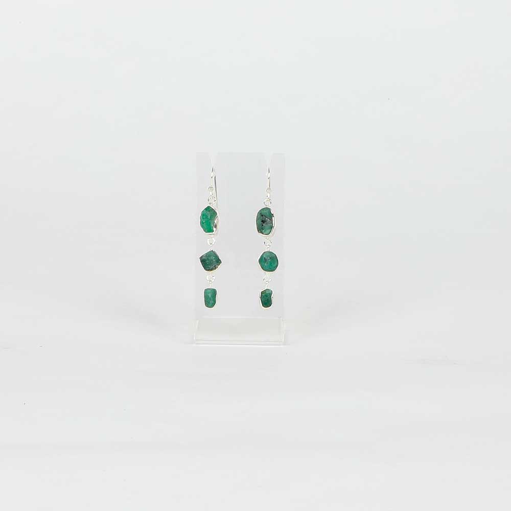 Emerald drop sterling silver earrings on white background