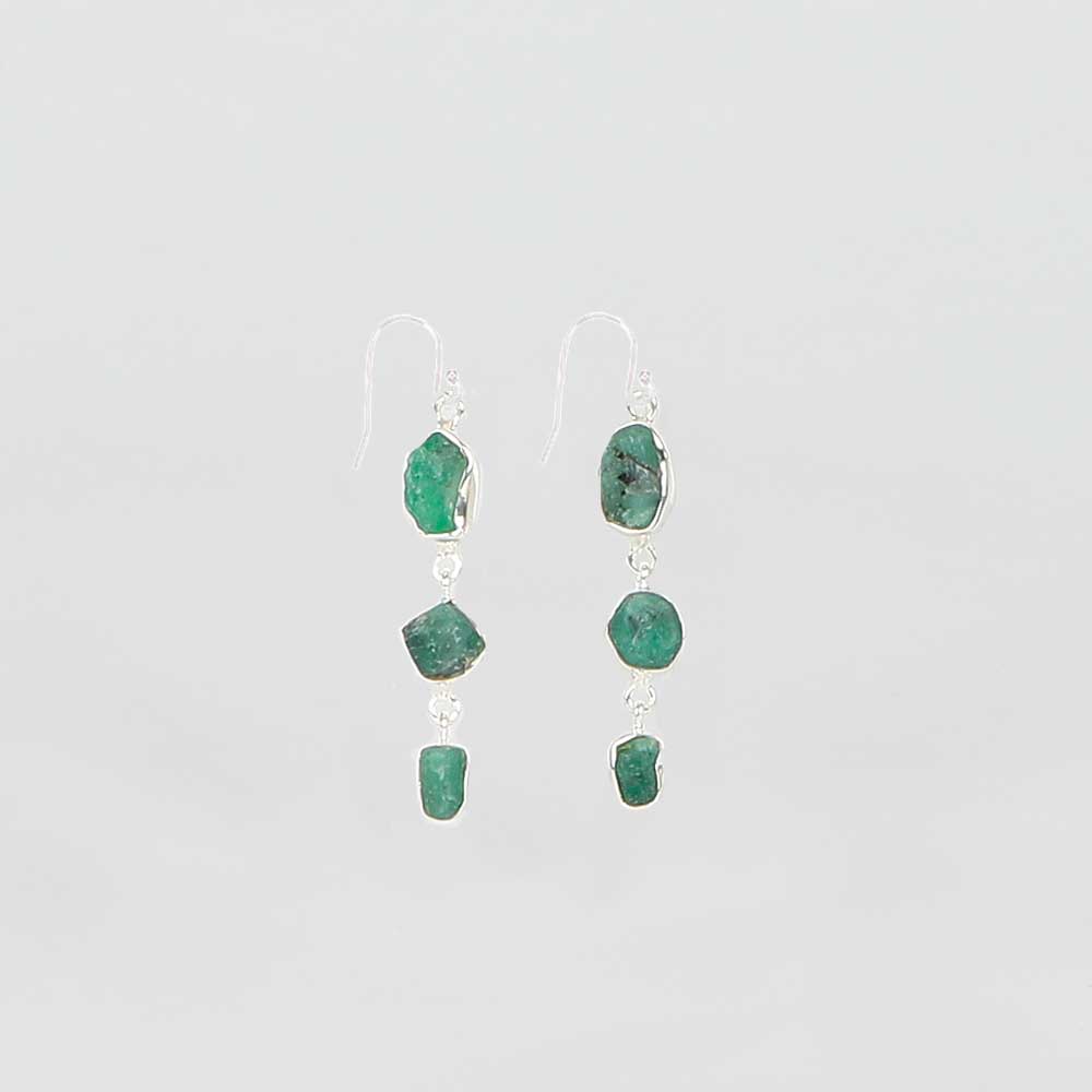 Emerald drop sterling silver earrings on white background