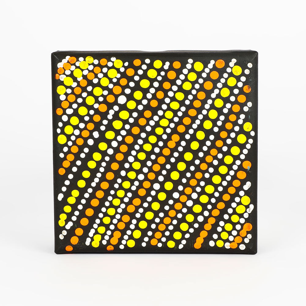 Handpainted canvas from Warlukurlangu Artists Cooperative on white background