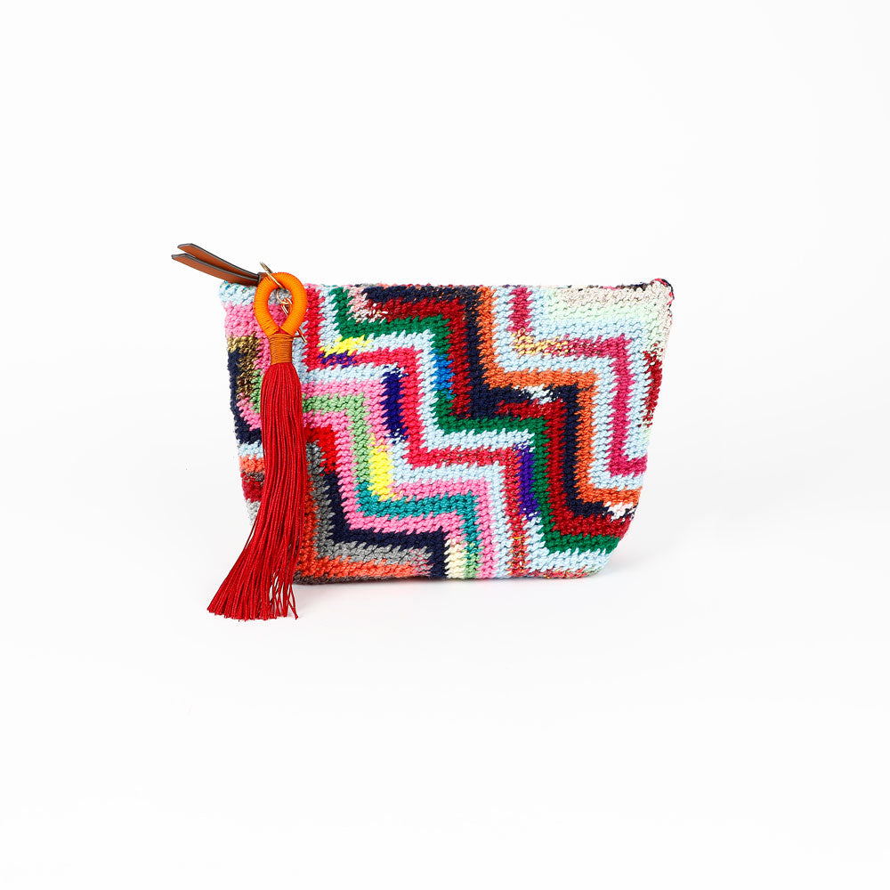 Colorful Florence Steps hand woven Bilum bag with geometric pattern, zip closure and orange and burgundy tassel, reverse view, on a white background