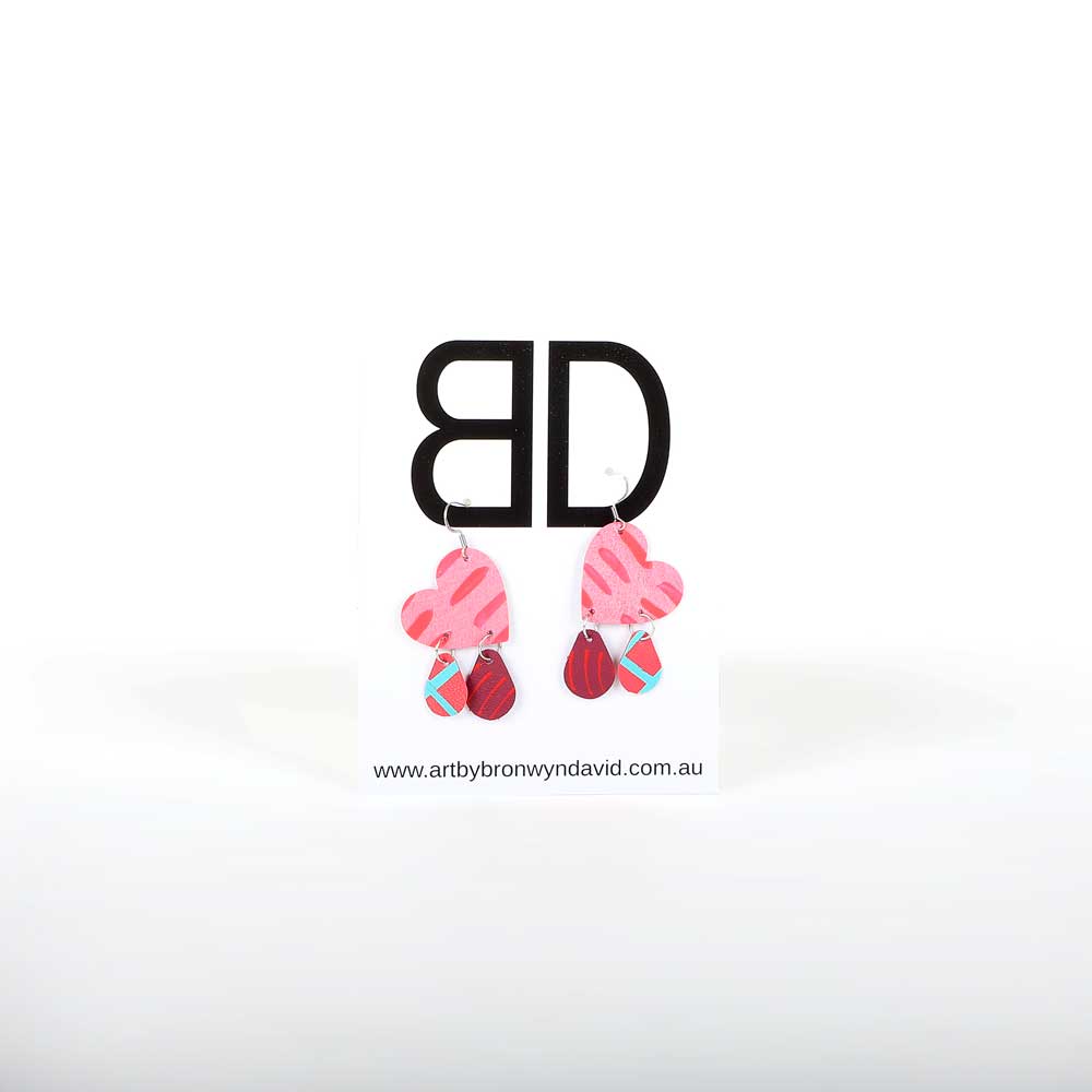 Bronwyn David cut hand painted leather Earrings with surgical steel hooks on white background