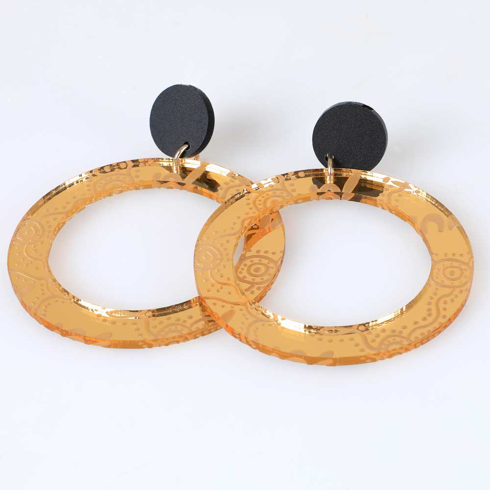 Gold wiradjuri mirrored hoop earrings. Haus of dizzy. photographed on white background for the Australian Museum shop online
