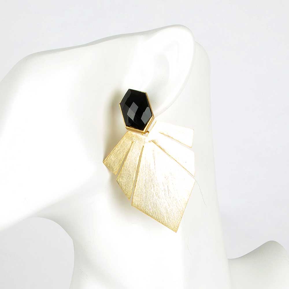 Gold fan earrings with onyx detail on white mannequin and background