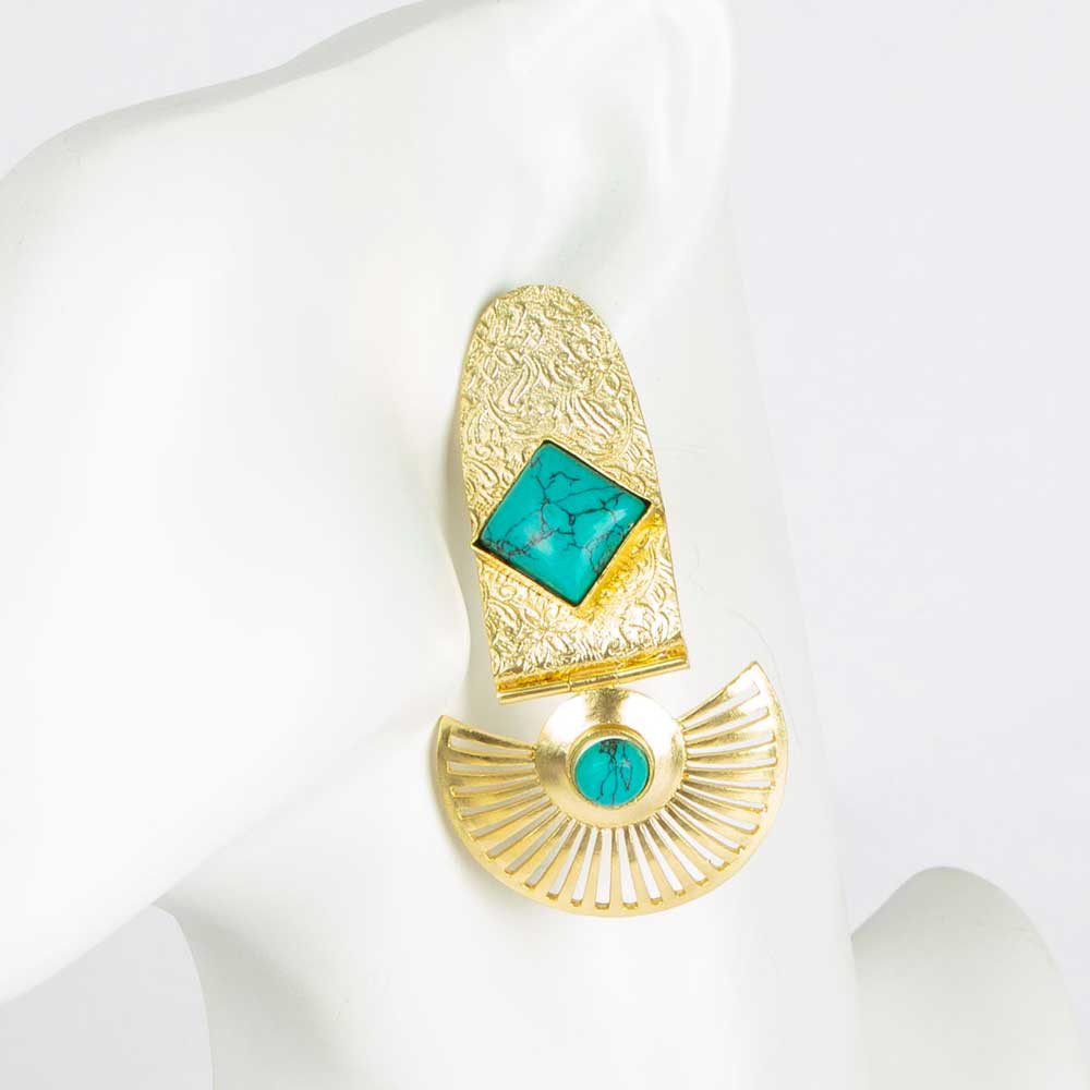 Gold metal earrings with turquoise detail on white mannequin