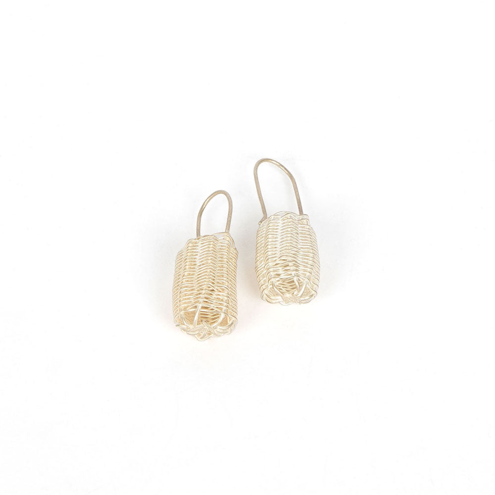 Silver handwoven dilly bag earrings on white background