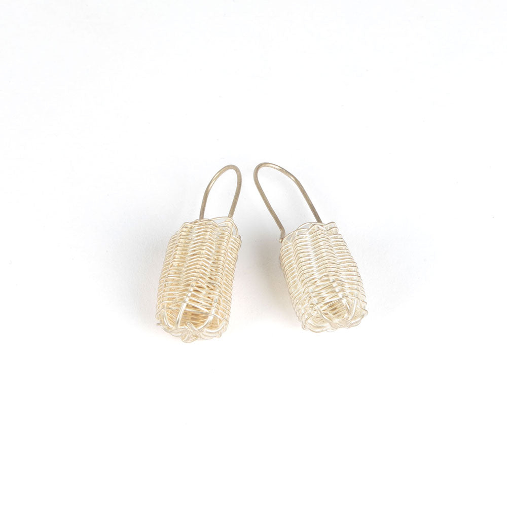 Silver handwoven dilly bag earrings on white background