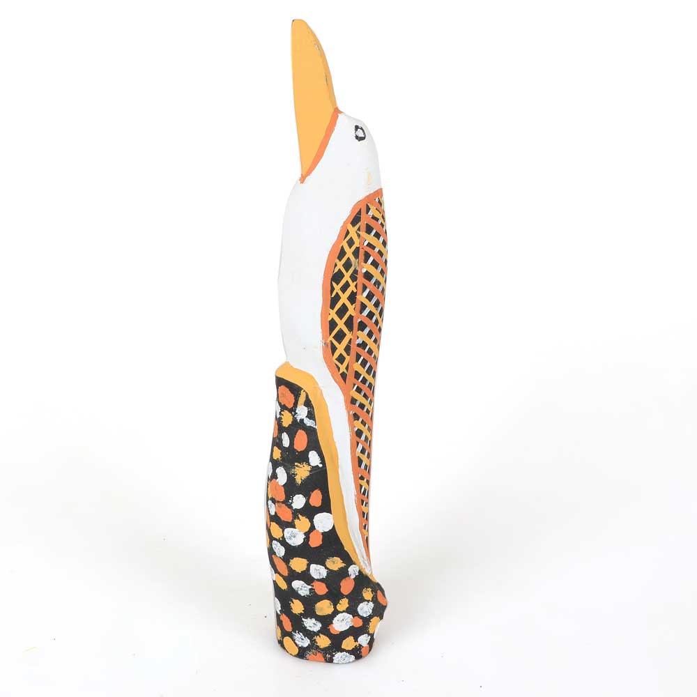 Hand carved bird by Tiwi artist Immaculata Tipliloura, photographed on white background for Australian Museum Shop online