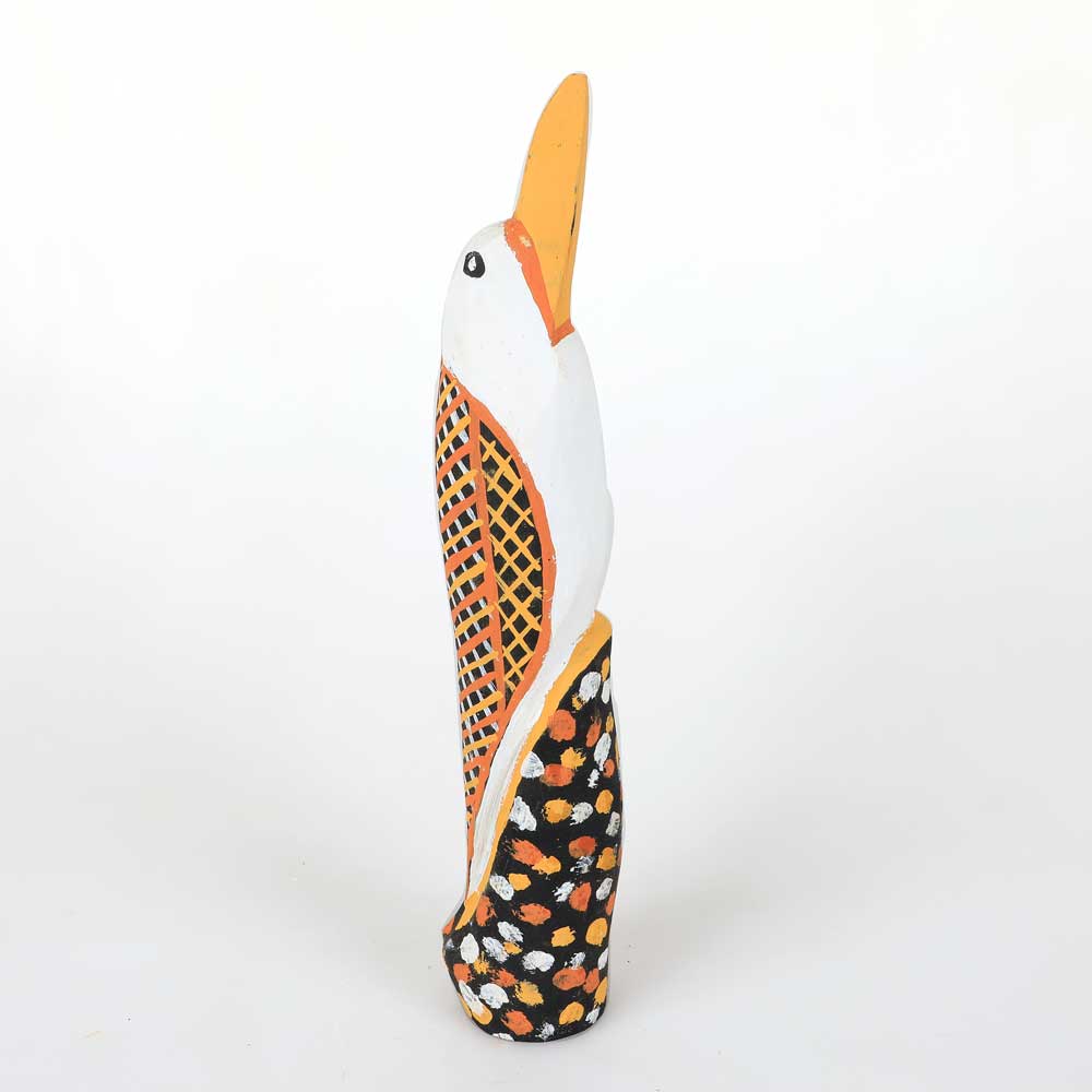 Hand carved bird by Tiwi artist Immaculata Tipliloura, photographed on white background for Australian Museum Shop online