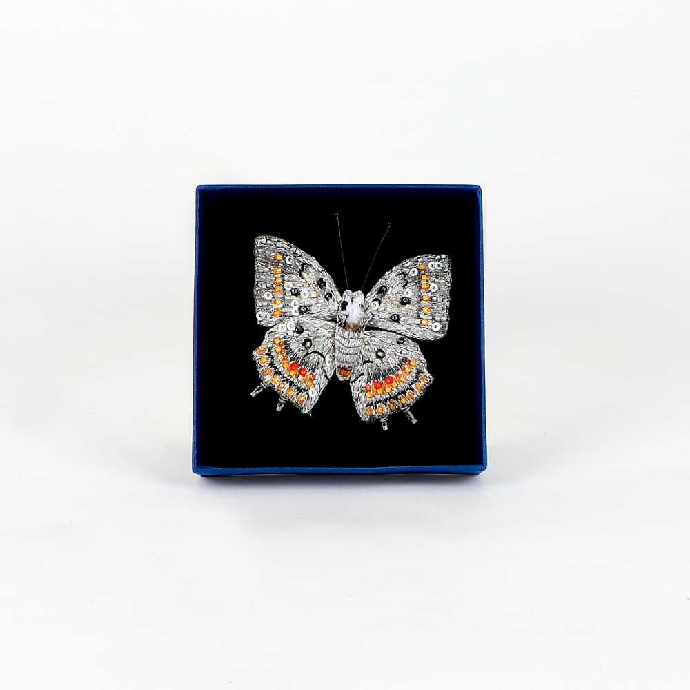 Trovelore Beaded nature brooch hand made in india on white background. Jewelled nawab butterfly