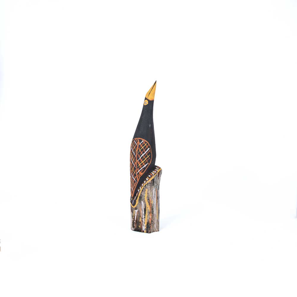 Elegant black cormorant Sculpture, hand carved and painted by John Babui, an artist and sculptor creating work at Tiwi Design, on white background