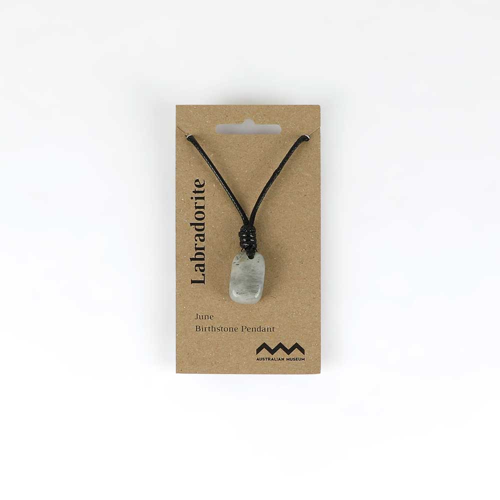 June birthstone pendant on leather and fibre necklace on white background for Australian Museum Shop online