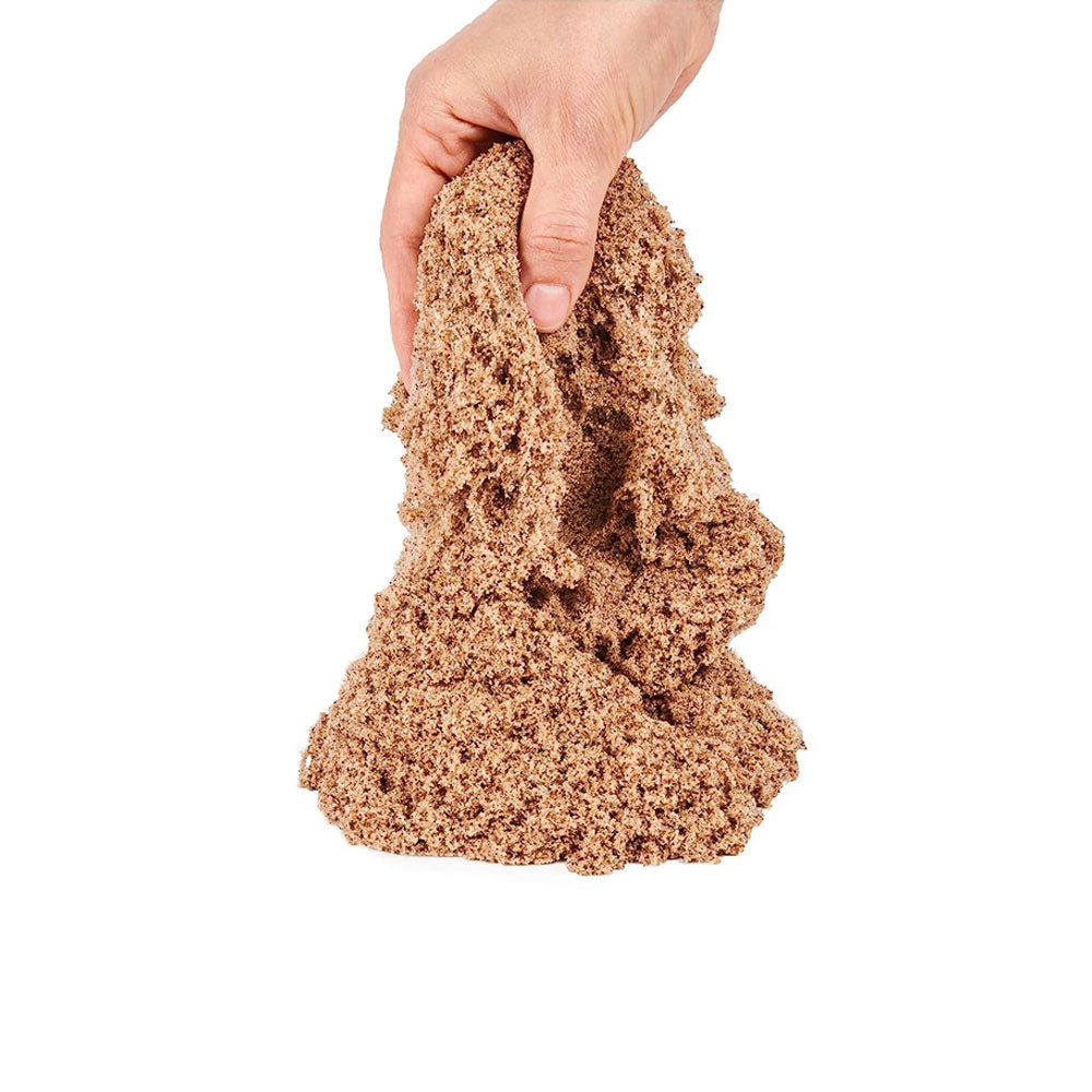 Tumbling Kinetic Sand on white background