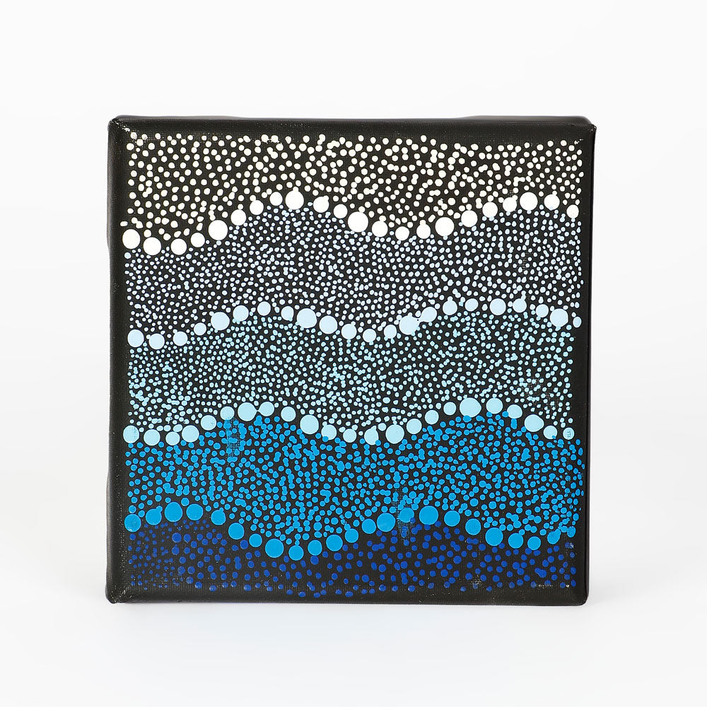 Handpainted canvas from Warlukurlangu Artists Cooperative on white background