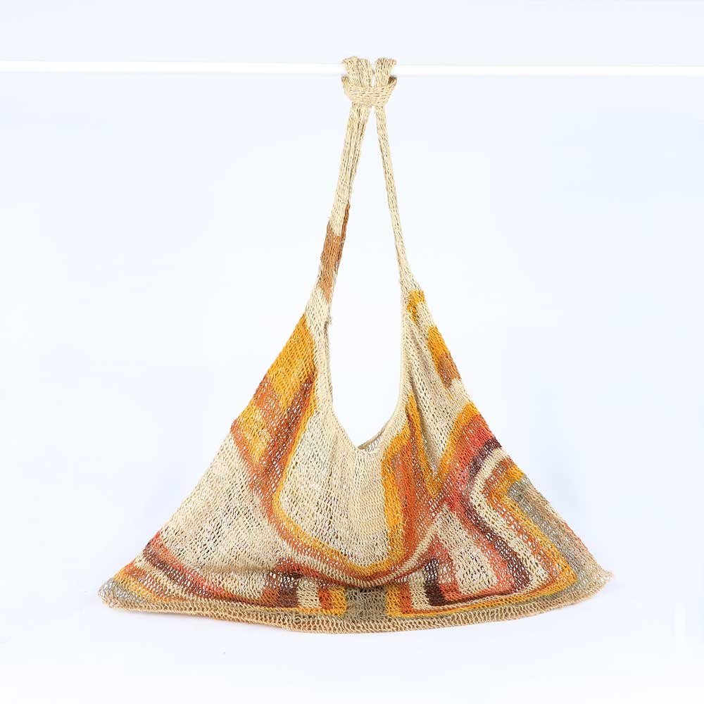 Lina Singu hand woven natural dyed Bilum Bag on white background