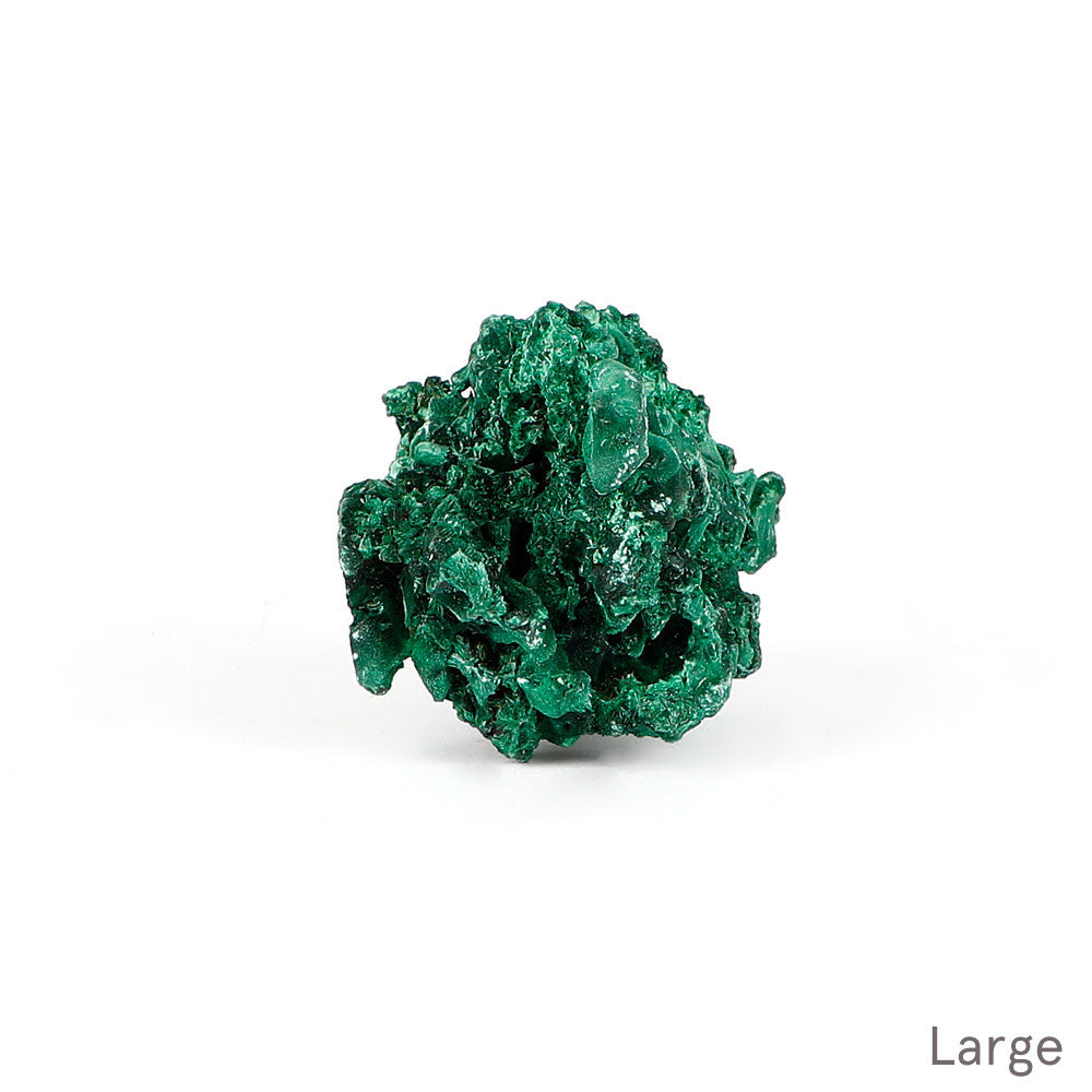 Malachite fibrous crystalline mineral specimen on a white background