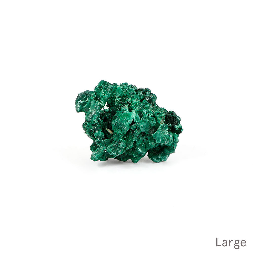 Malachite fibrous crystalline mineral specimen on a white background