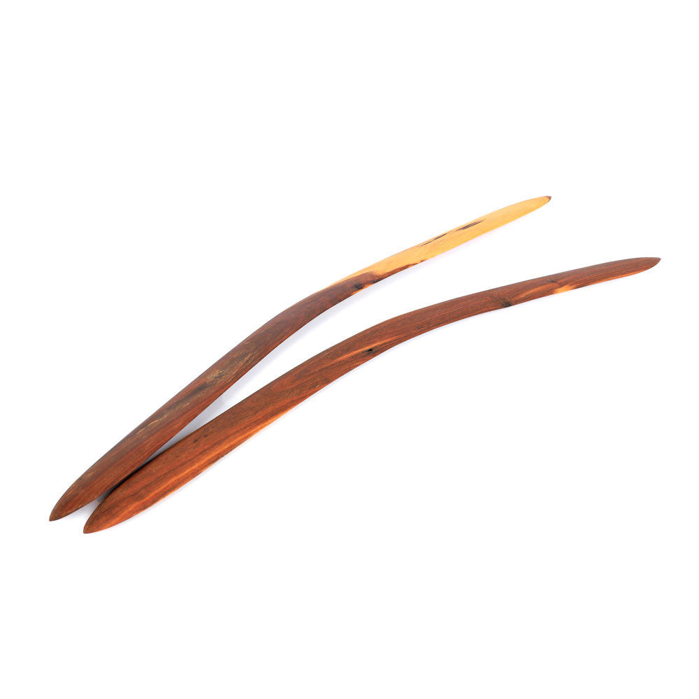 Ceremonial boomerang set  hand carved by Laurence Magick Dennis on white background