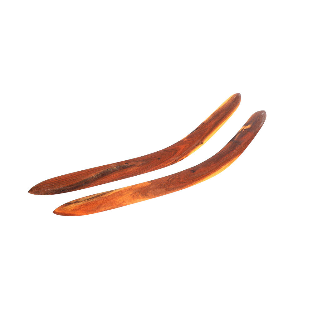 Ceremonial boomerang set  hand carved by Laurence Magick Dennis on white background