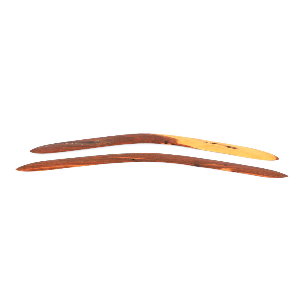 Ceremonial boomerang set  hand carved by Laurence Magick Dennis on white background