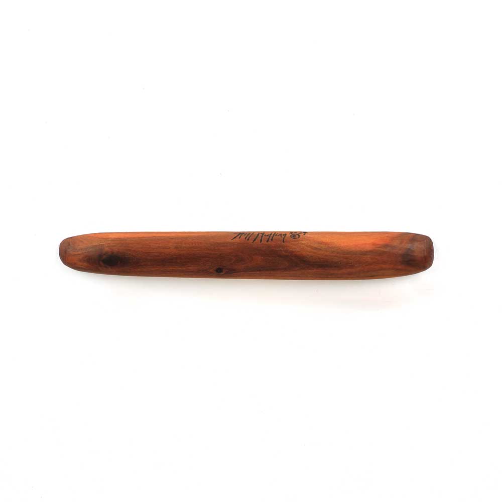 Hand Carved Message Stick on white background