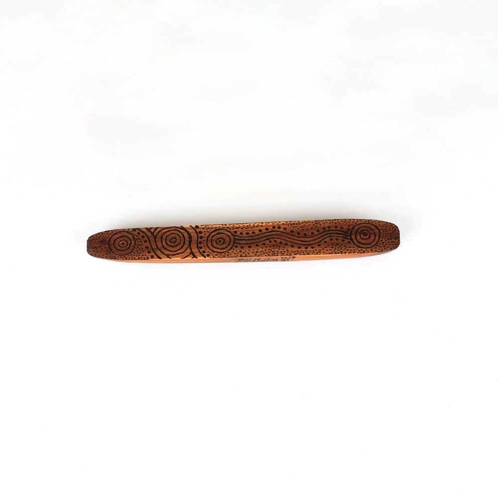 Hand Carved Message Stick on white background