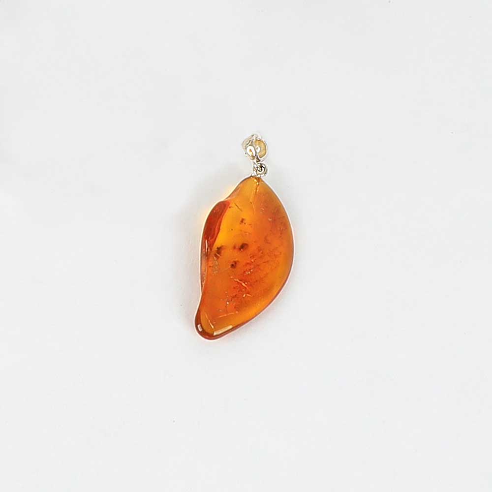 Natural Amber Pendant on white background