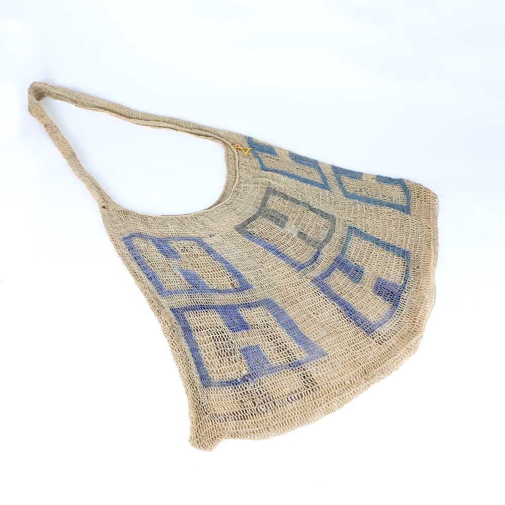 Large natural Bilum Bag from the sepik River region of Papua New Guinea, on white background