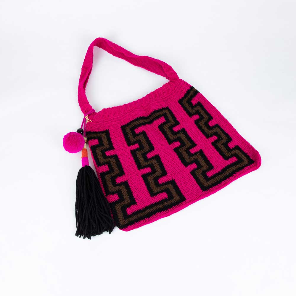 Pink brown and black handwoven bilum bag by Rosa Hofman on white background