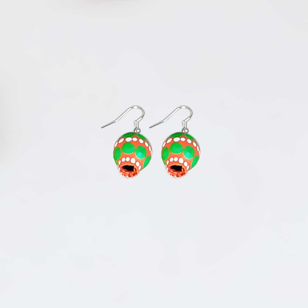 Painted seed earrings on white background