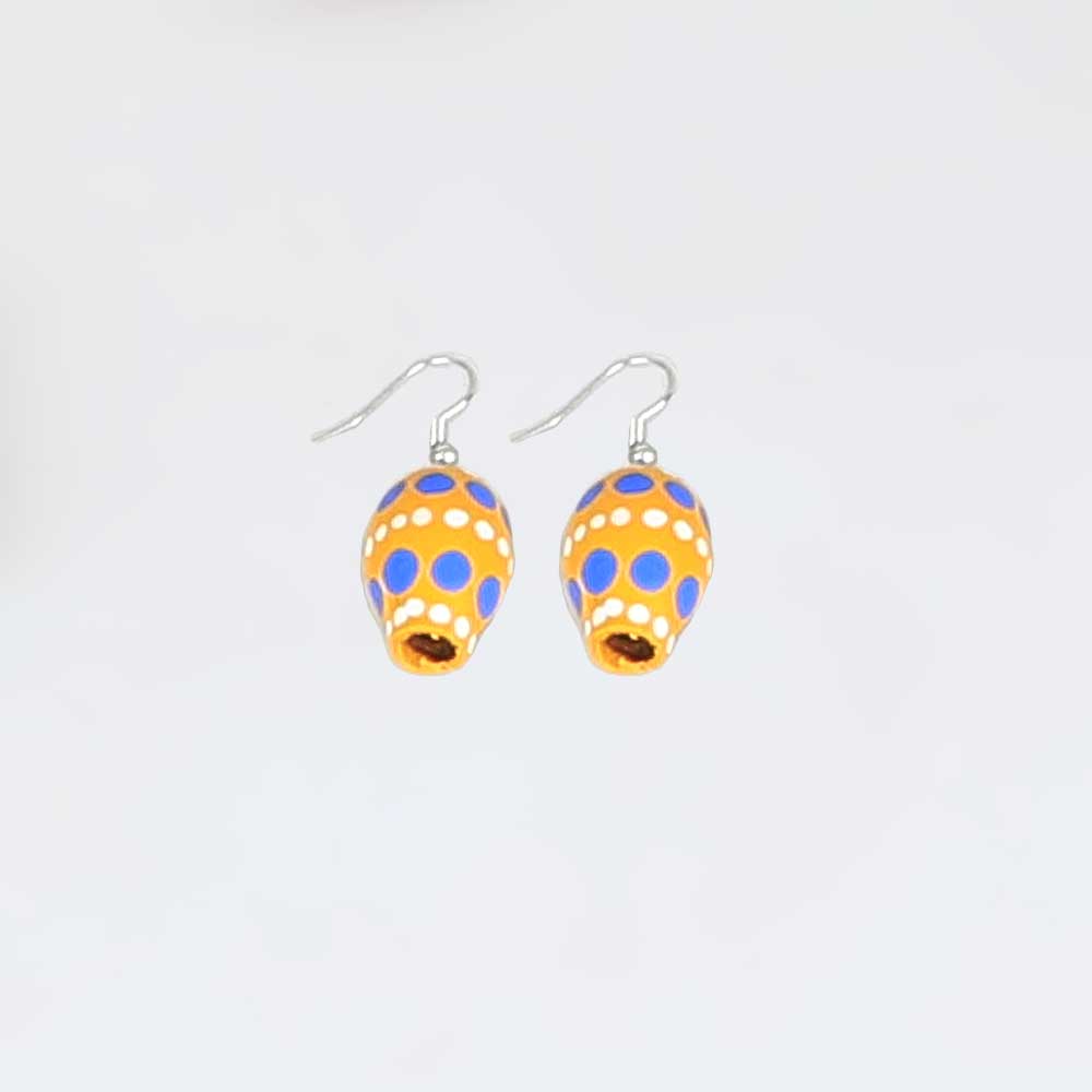 Painted seed earrings on white background