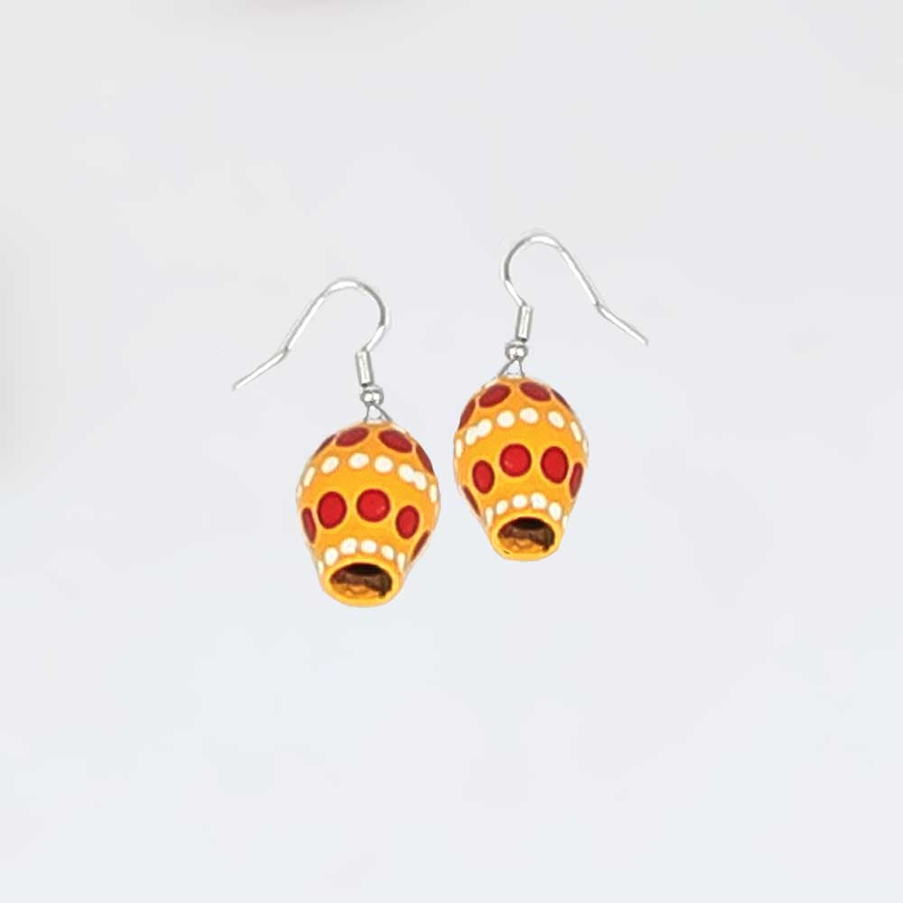 Painted seed earrings on white background