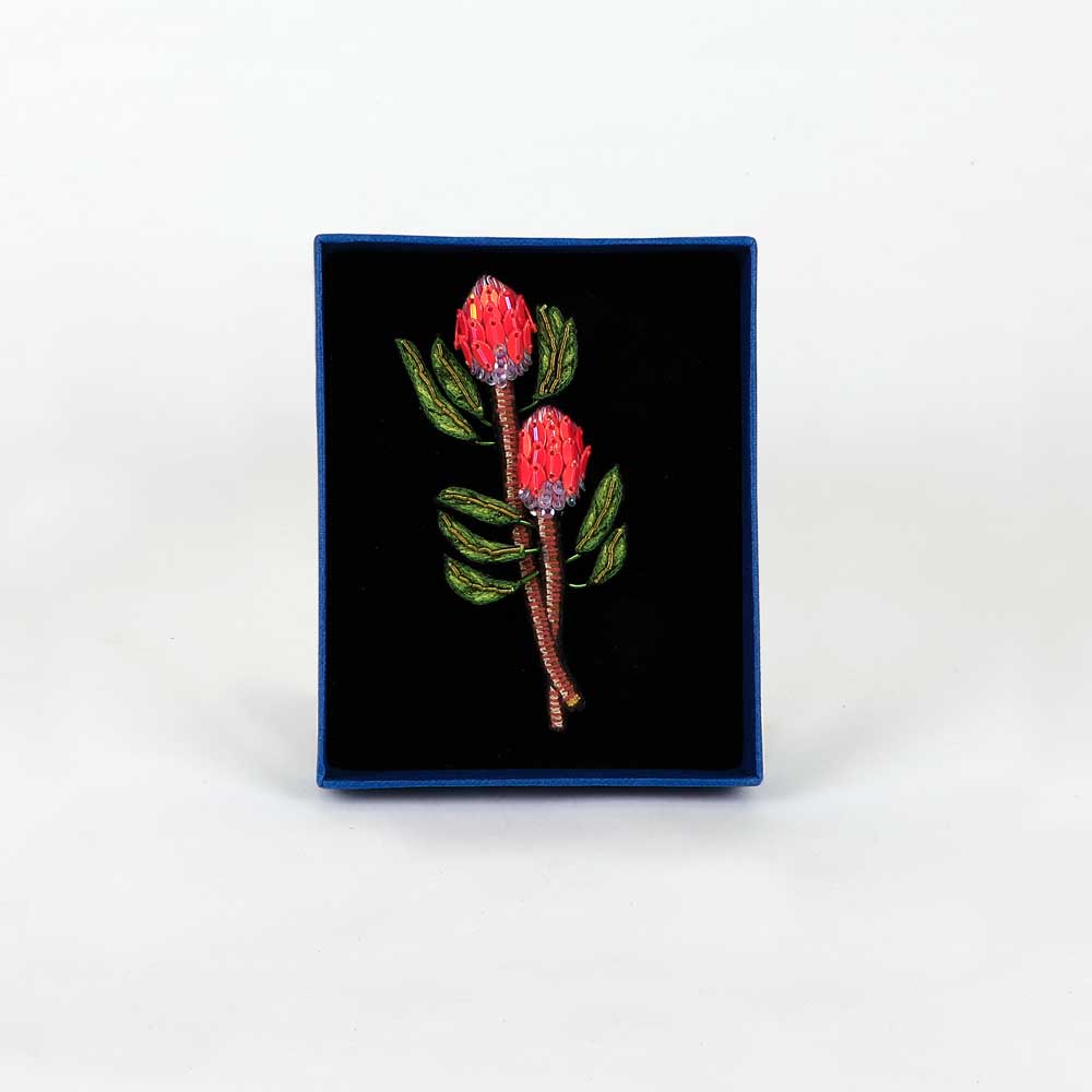 Pink protea Trovelore Beaded embroidered floral brooch on white background