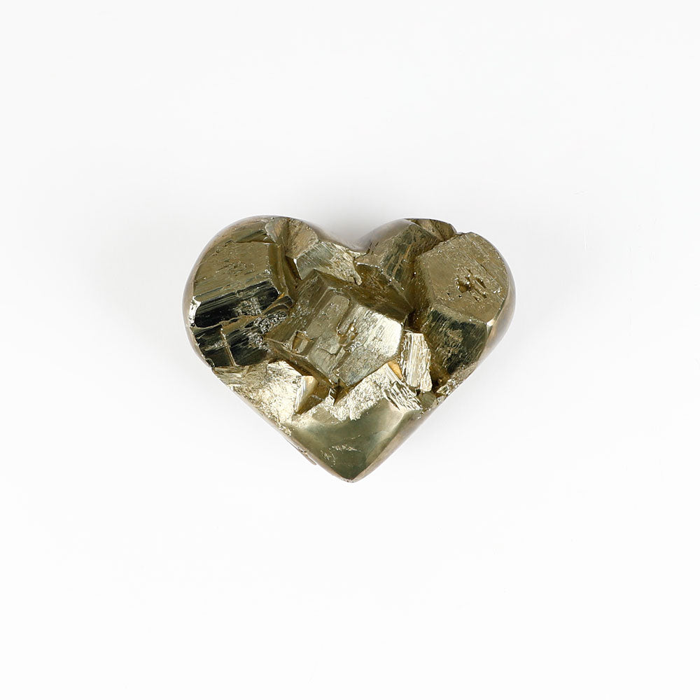 Heart-shaped raw pyrite specimen on a white background