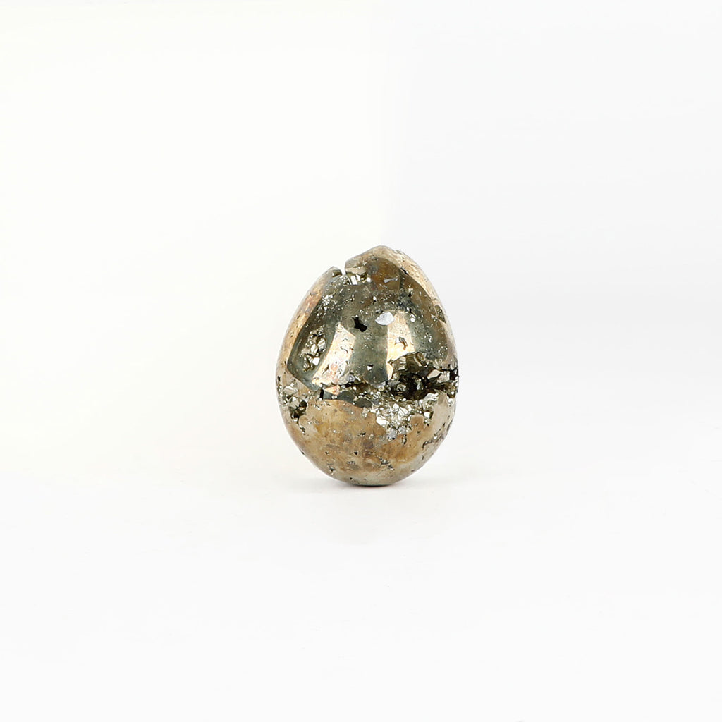 Egg shaped Pyrite crystal on a white background