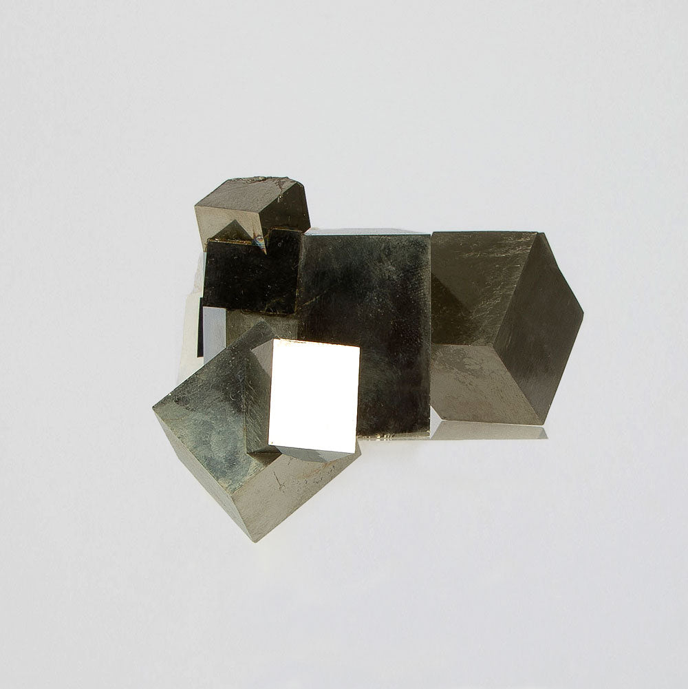 Natural Pyrite Mineral Specimen of Cubic Crystal Clusters on white background